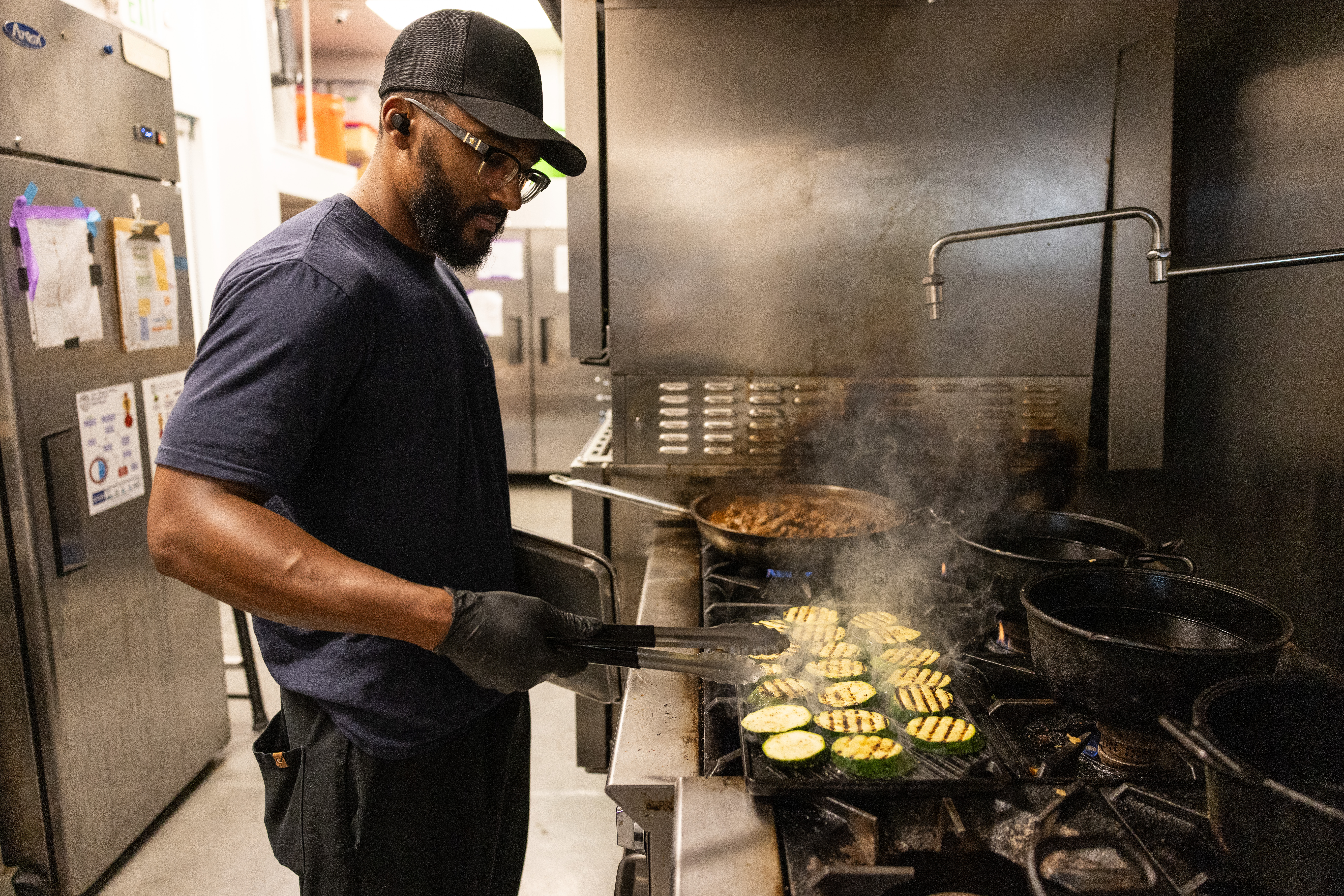 Chef Randy preparing food for Chef Alyssa's Kitchen lunch catering.
